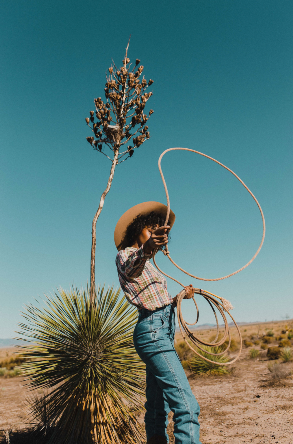 Raba Marfa campaign with a woman roping in the desert