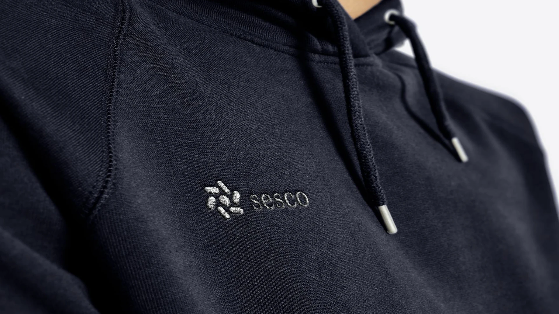 Sesco logo embroidered on a dark hoodie